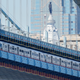 A Port Authority Transit Corporation (PATCO) train travels across the Benjamin Franklin Bridge in view of City Hall in Philadelphia, Friday, April 23, 2021.